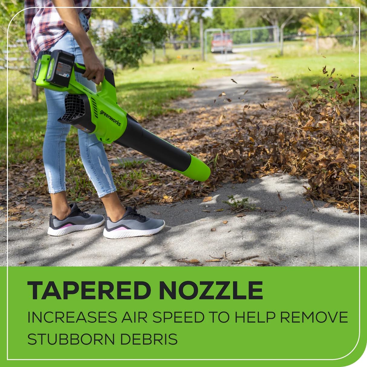Greenworks blower held in hand to show scale and easy maneuverability benefit