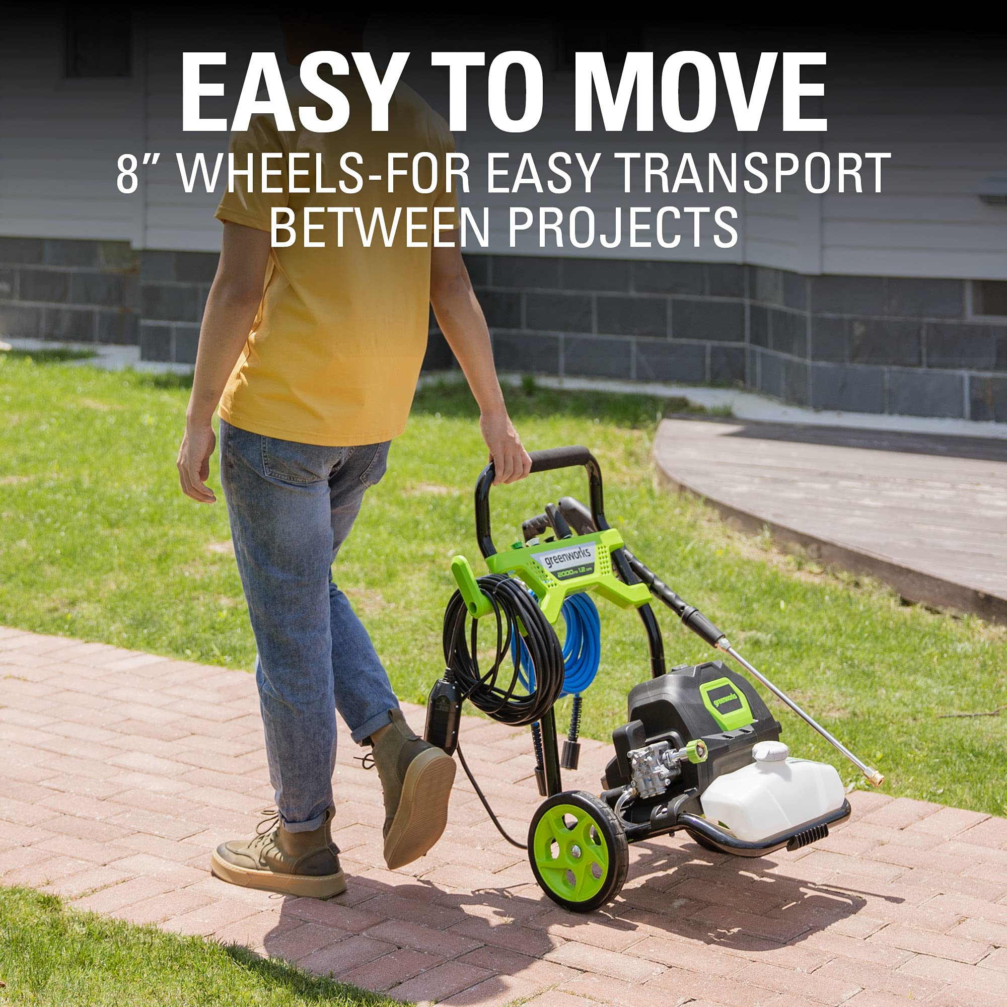 Greenworks unit held by hands showing scale and easy transport benefit