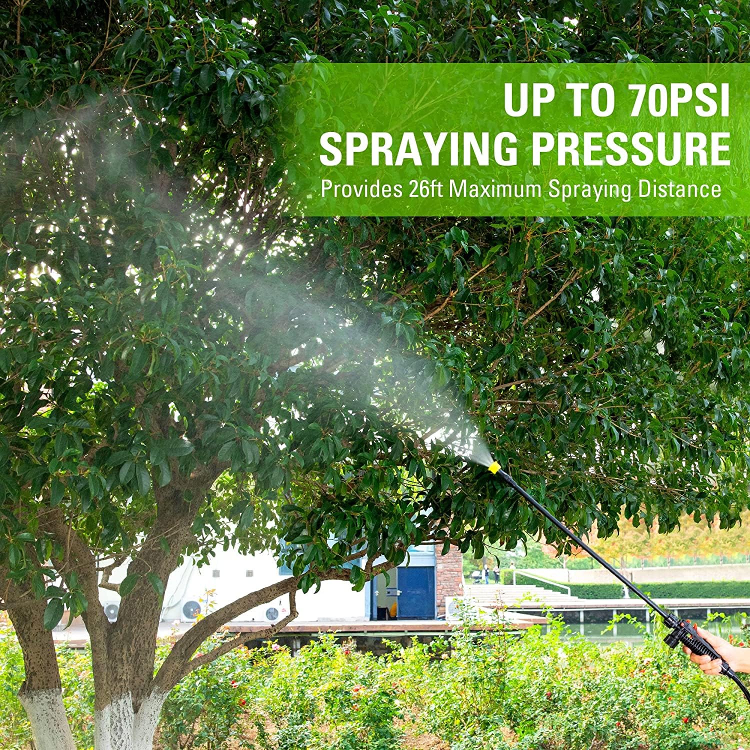 Greenworks sprayer used in garden showing reach and cordless convenience during treatment