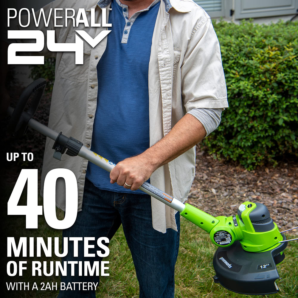 Greenworks tools held in hand for scale showing lightweight ergonomic handling