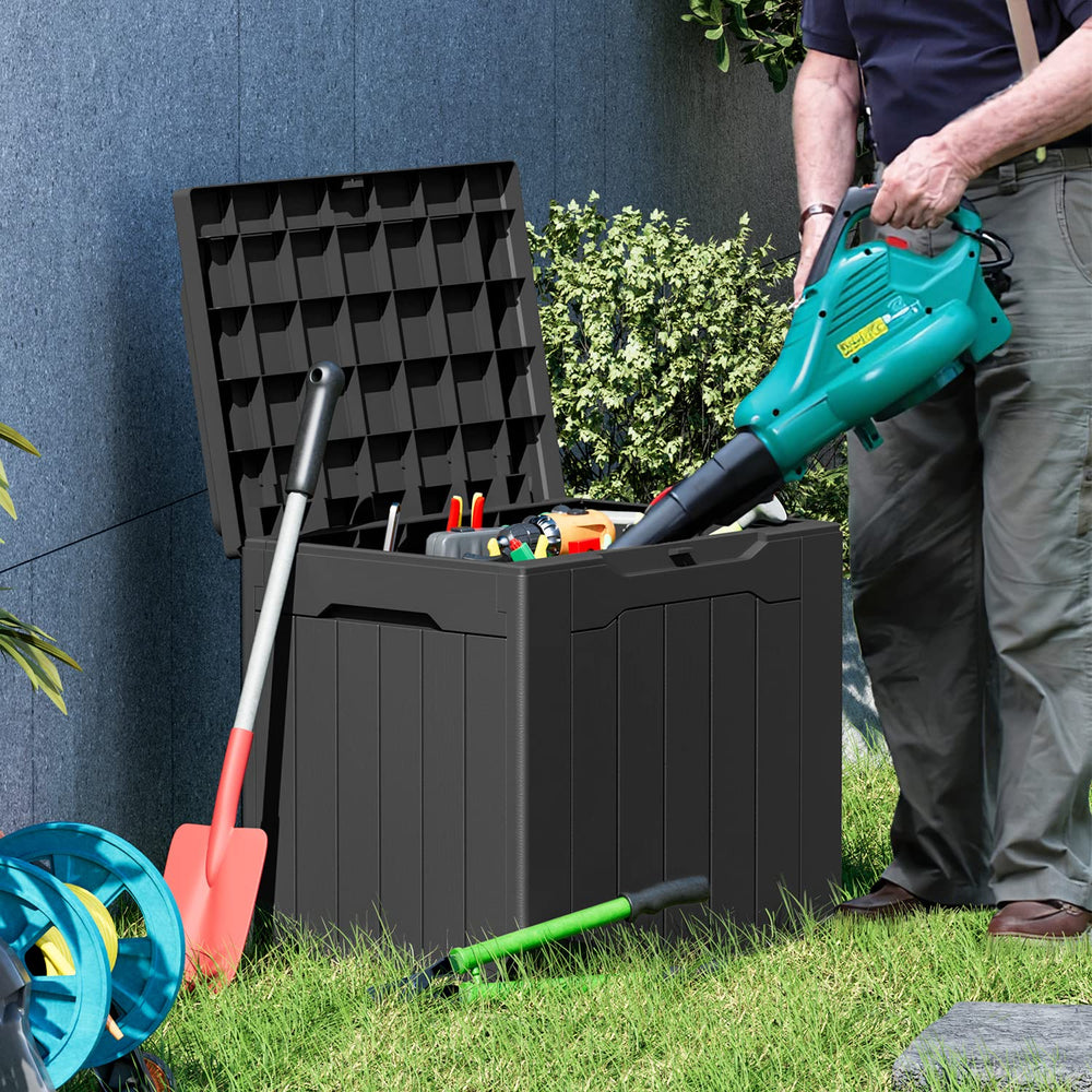 Greesum outdoor patio scene showing box used as seat and storage solution