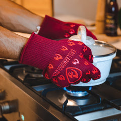 Grill Armor gloves with fingers grasping hot grill grate for control