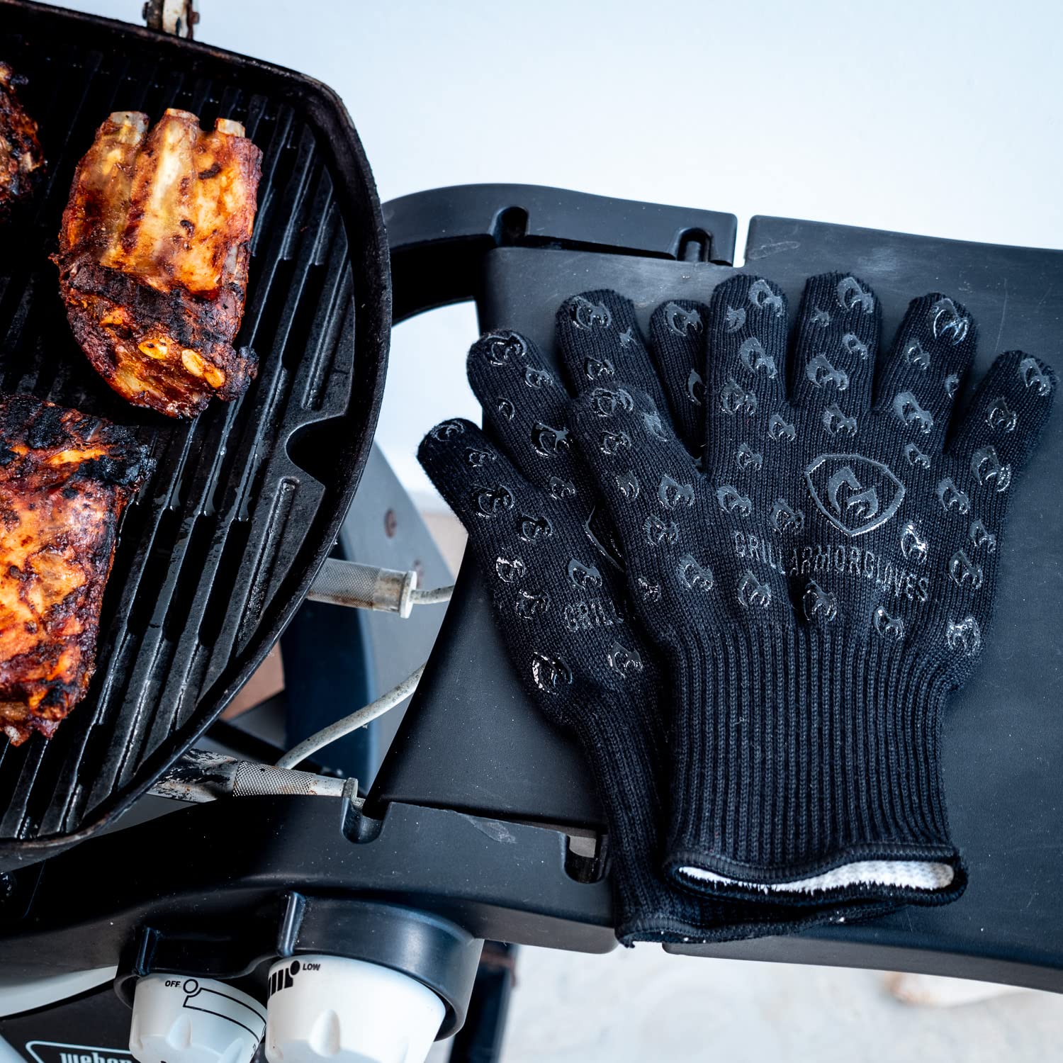 Grill Armor lifting hot cast-iron pan safely from oven