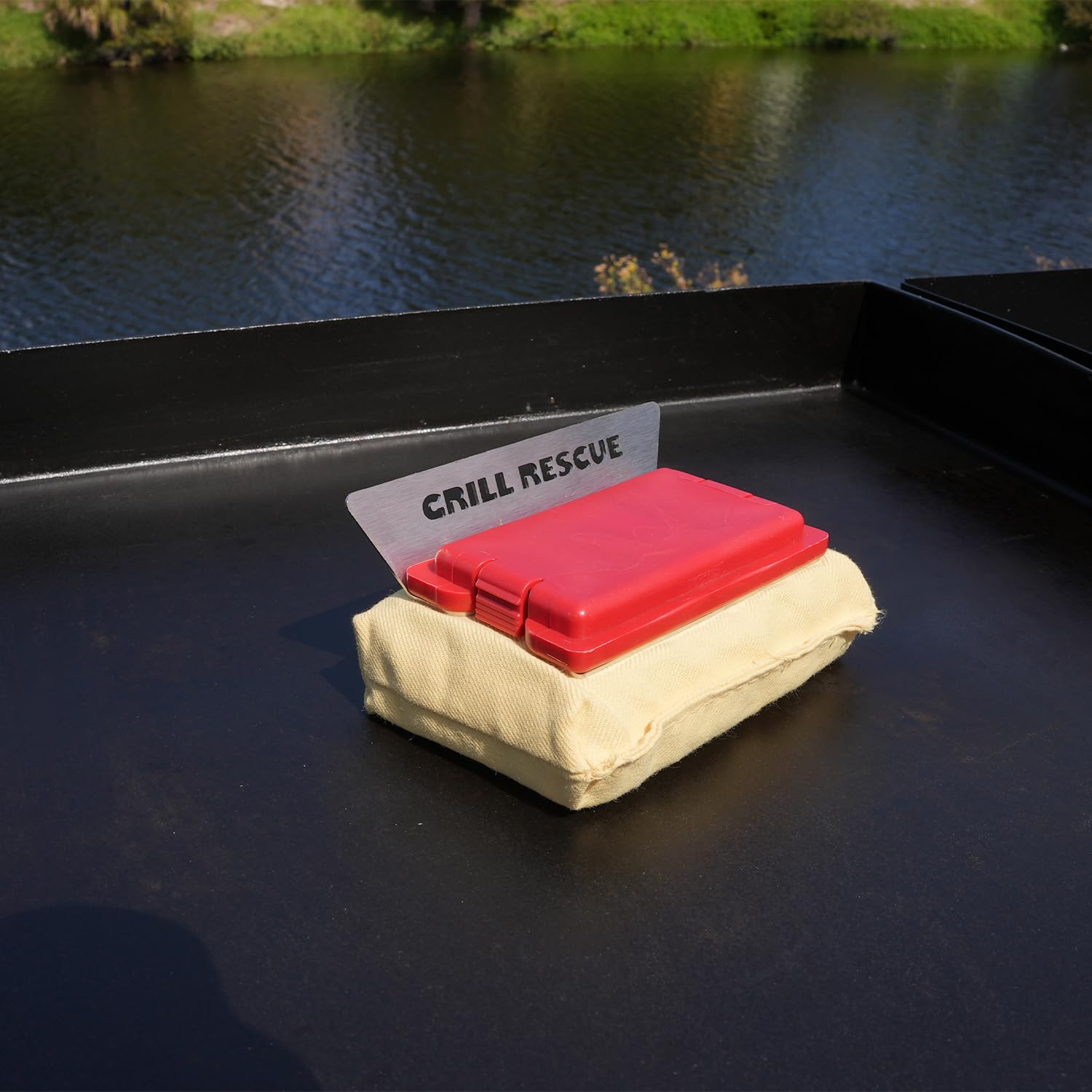Grill Rescue griddle head in use on a flat top demonstrating fast warm-clean performance
