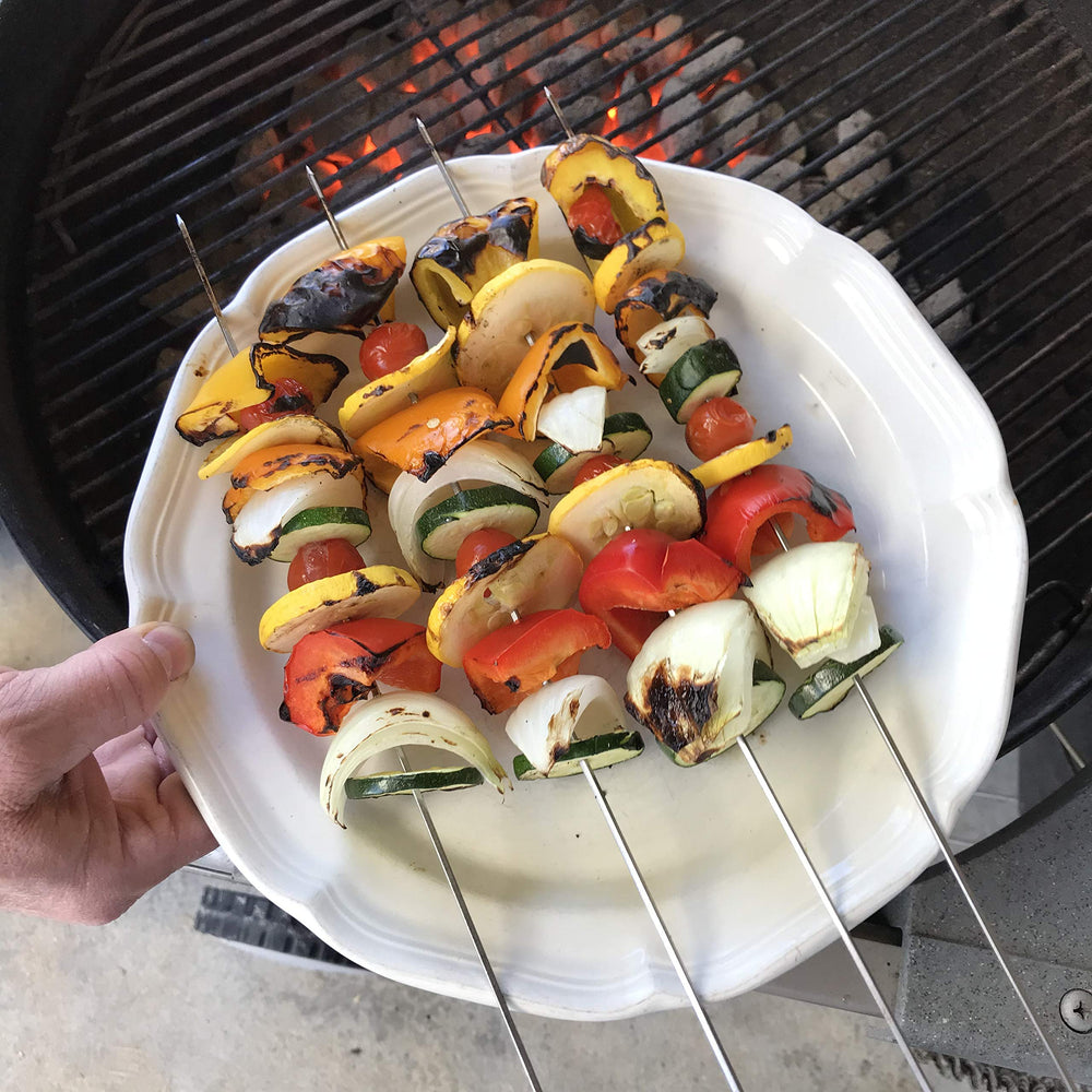 Grillers Choice loaded skewers on a grill cooking evenly for better results