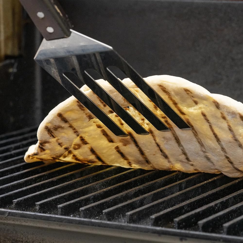GrillGrate tool on grill side in lifestyle scene for efficient grilling benefit