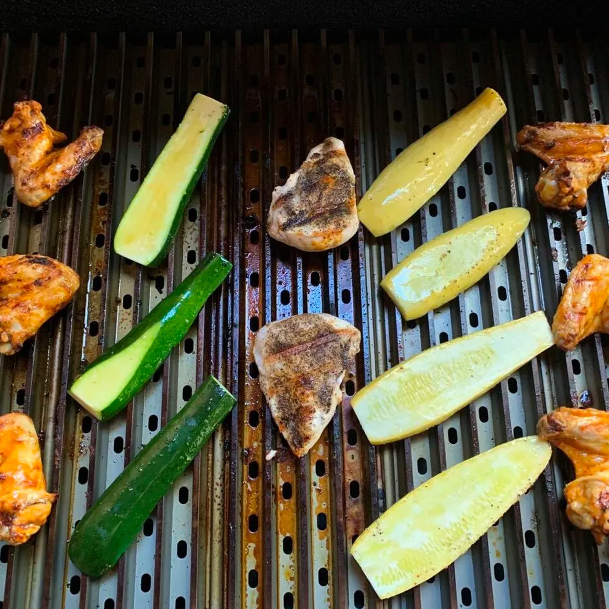 GrillGrate installed on a small gas grill demonstrating even heat distribution and fit