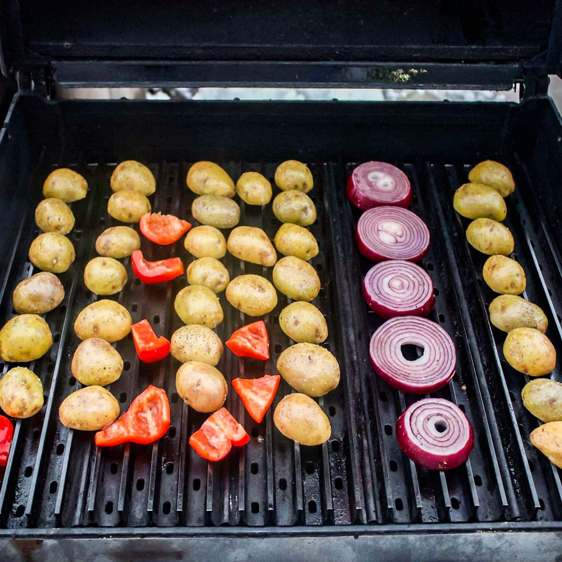 GrillGrate rails-down griddle with eggs and vegetables showing versatile cooking benefit
