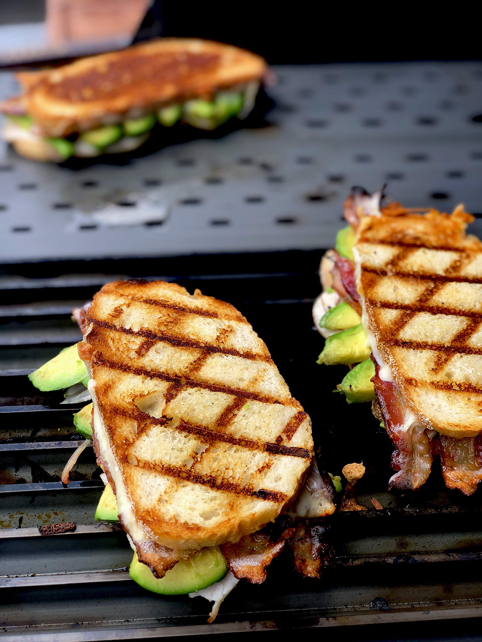 GrillGrate searing steak with bold GrillGrate marks and flavor