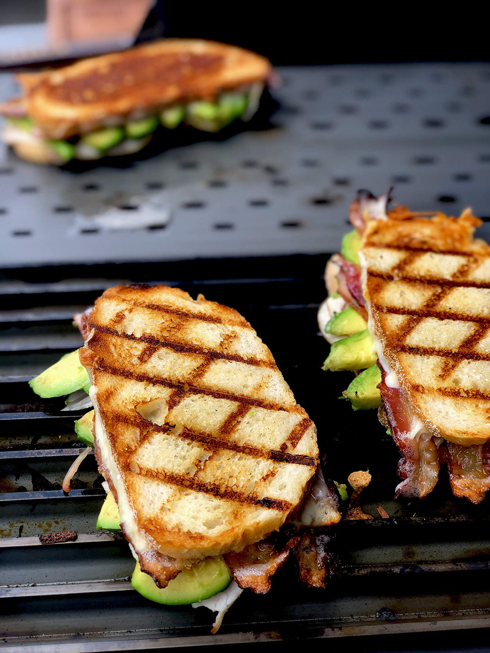 GrillGrate searing steak with bold GrillGrate marks and flavor