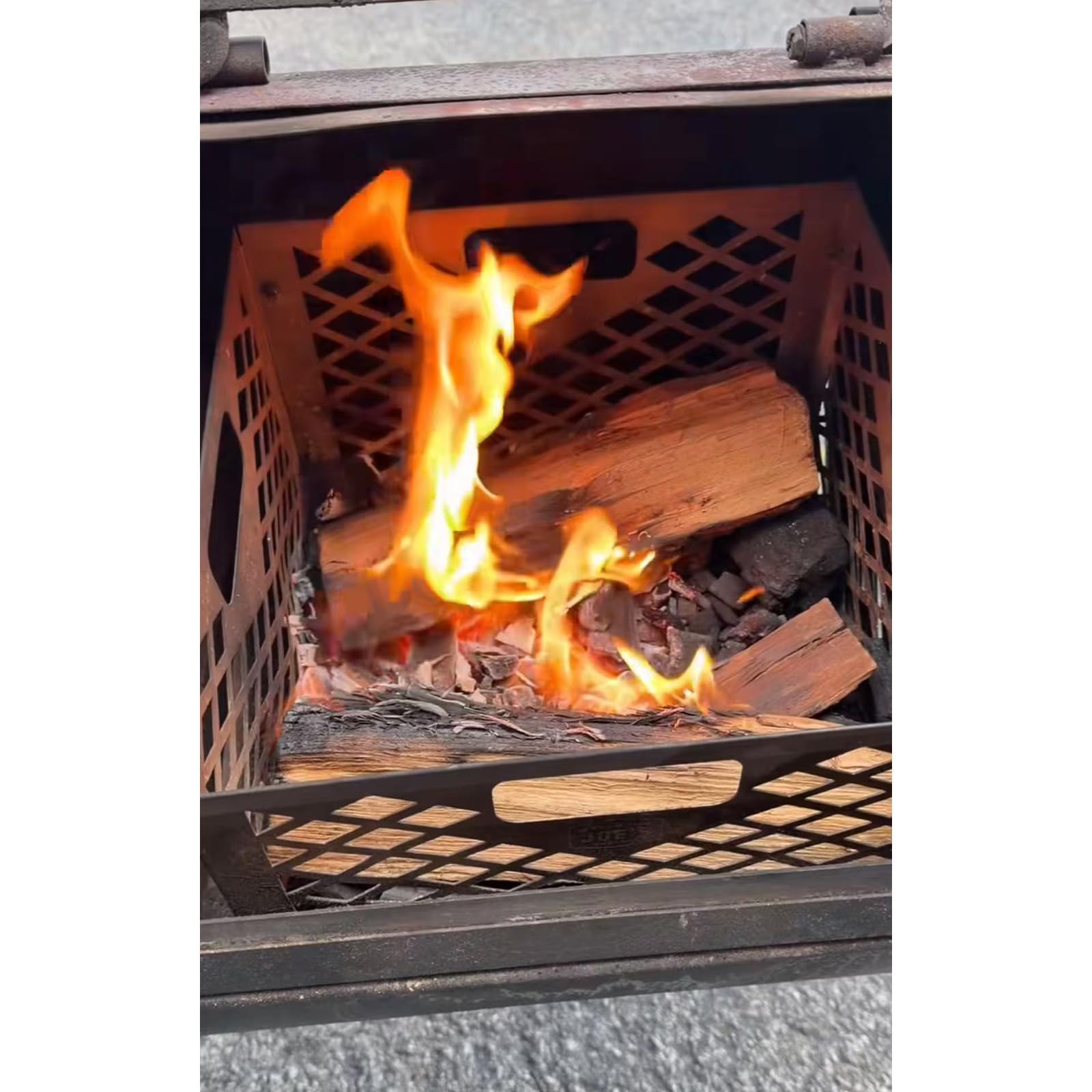 Grilltonic basket next to charcoal bag showing compact size and easy fuel capacity