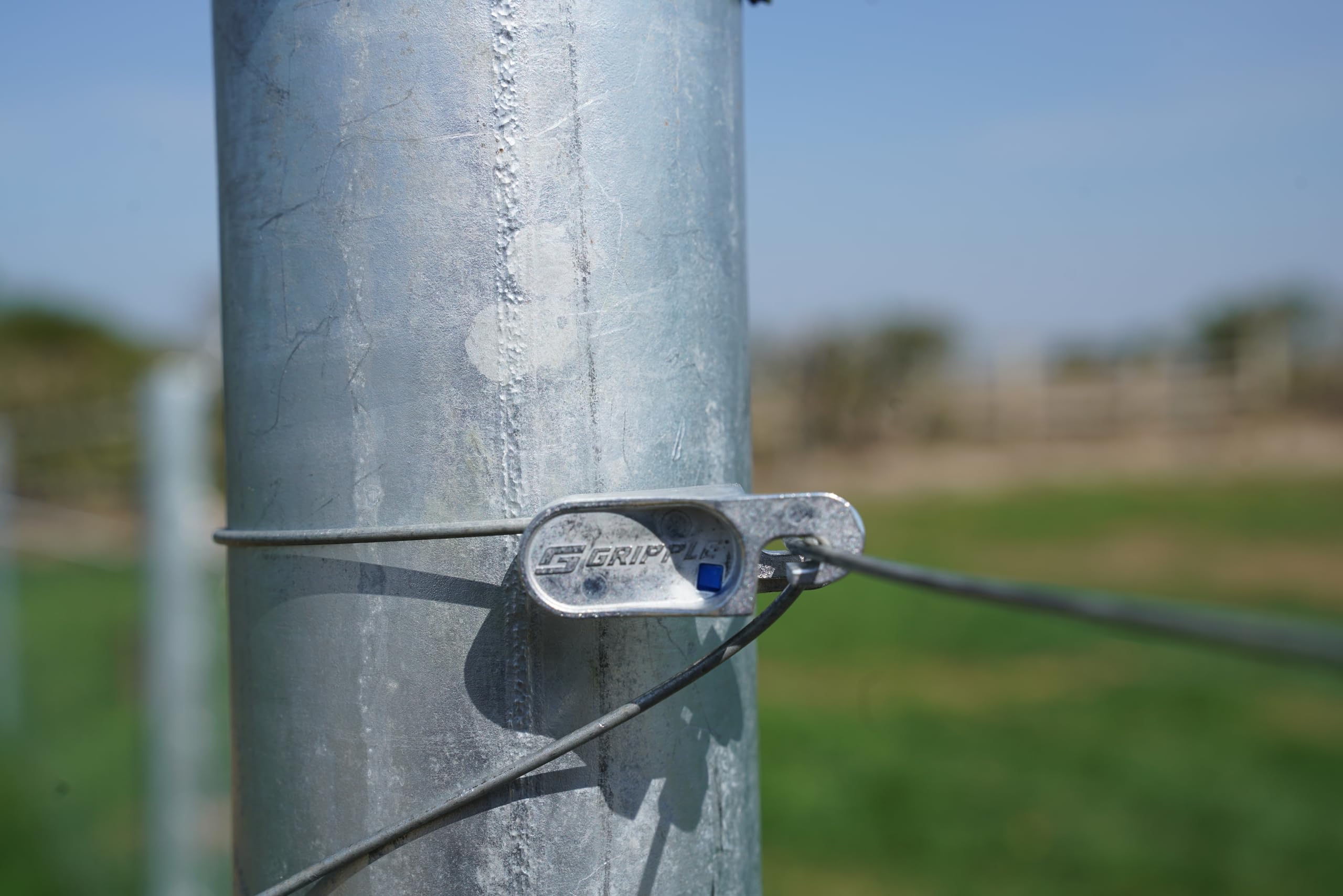 GRIPPLE T-Clip holding barbed wire taut with clear secure termination benefit