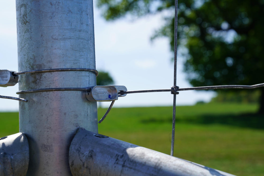 GRIPPLE T-Clip on a livestock fence demonstrating professional finish