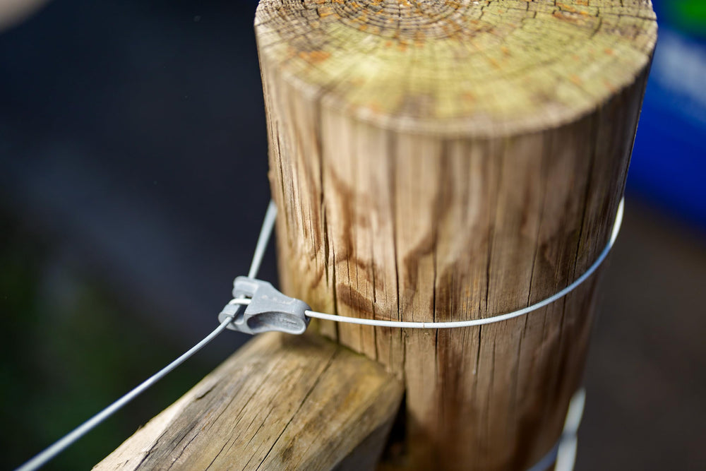 GRIPPLE T-Clip beside a ruler showing compact size and easy handling advantage
