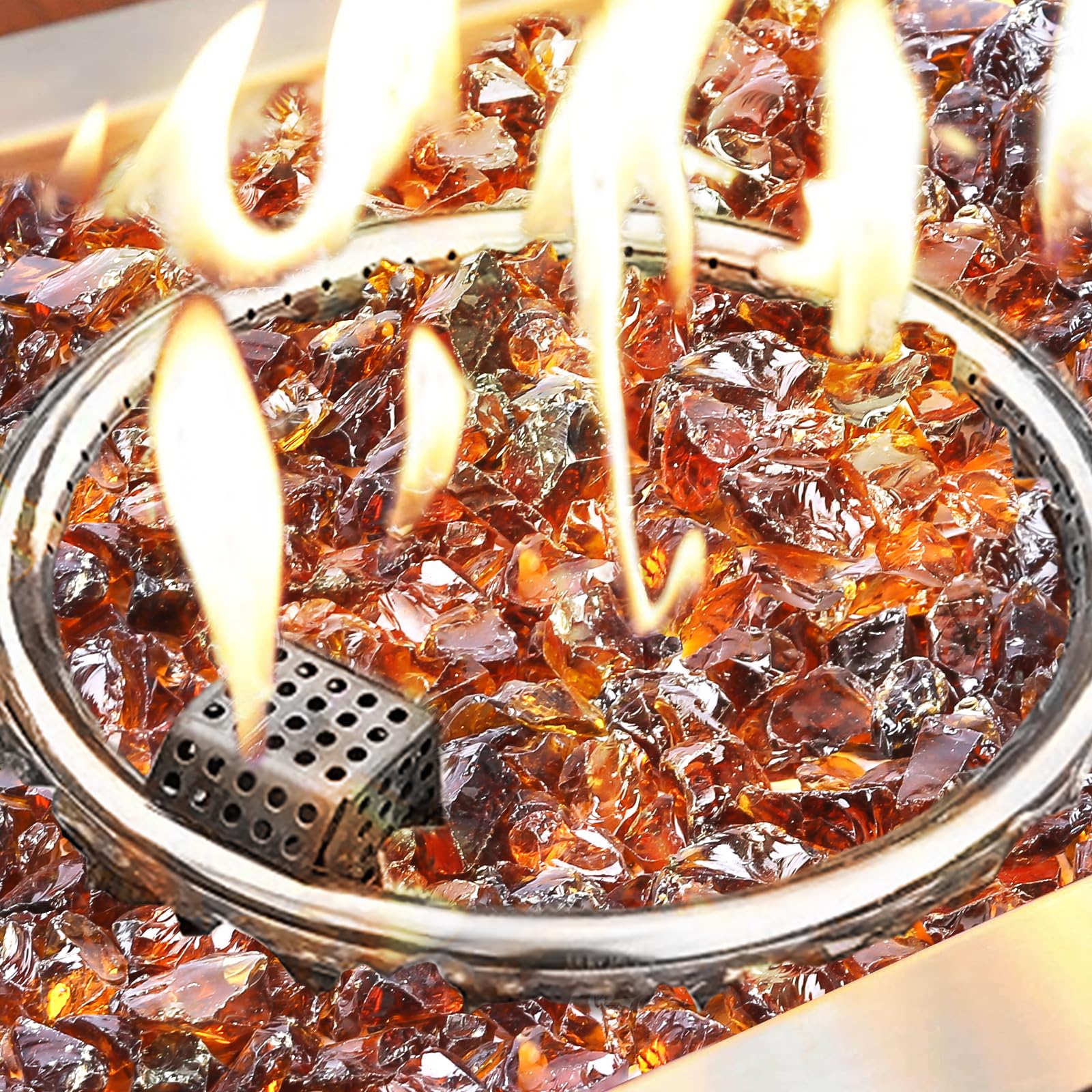 GRISUN amber fire glass in a lit fire pit creating warm shimmering flames