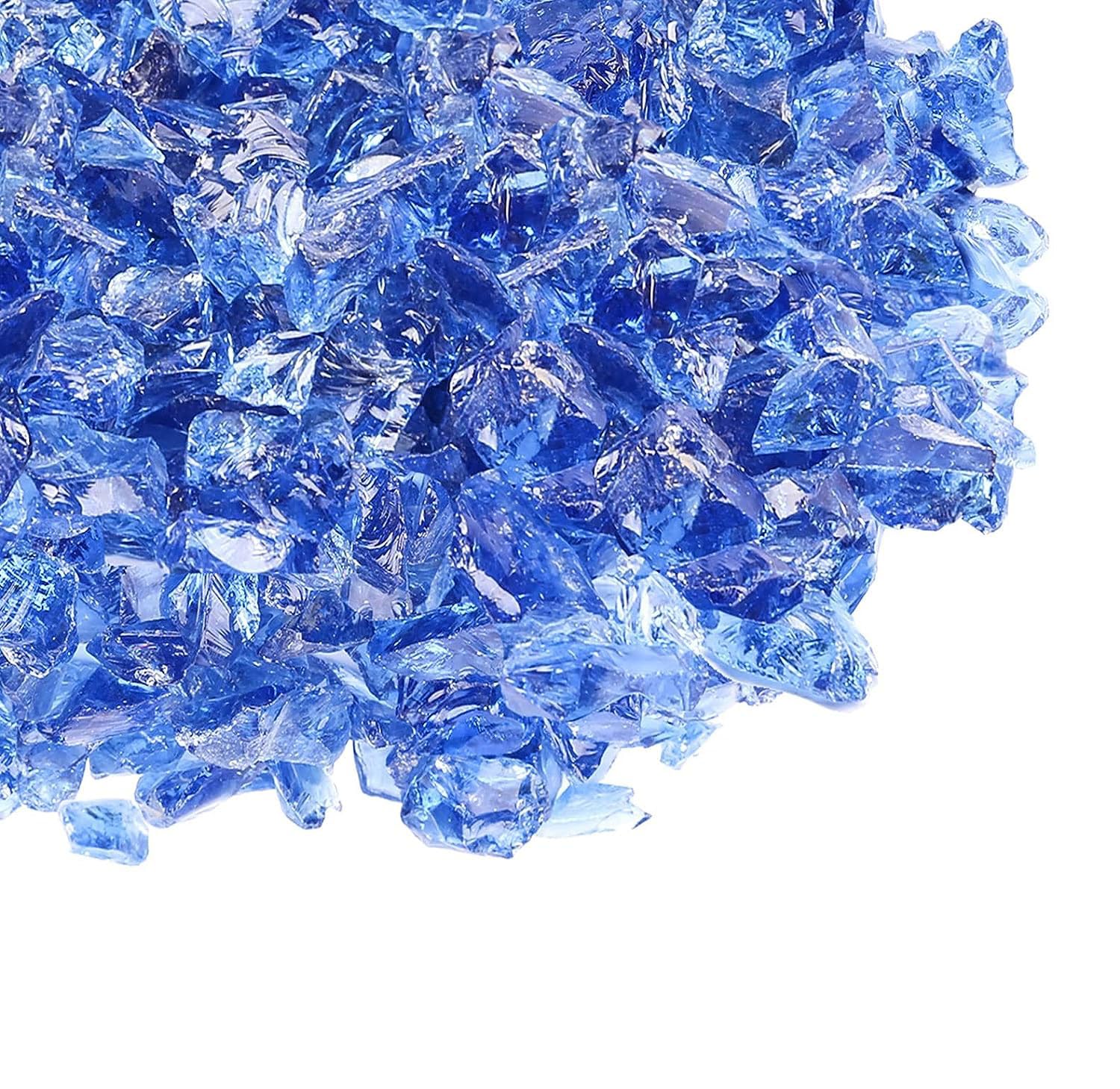 GRISUN evening patio scene with blue fire glass creating warm decorative glow