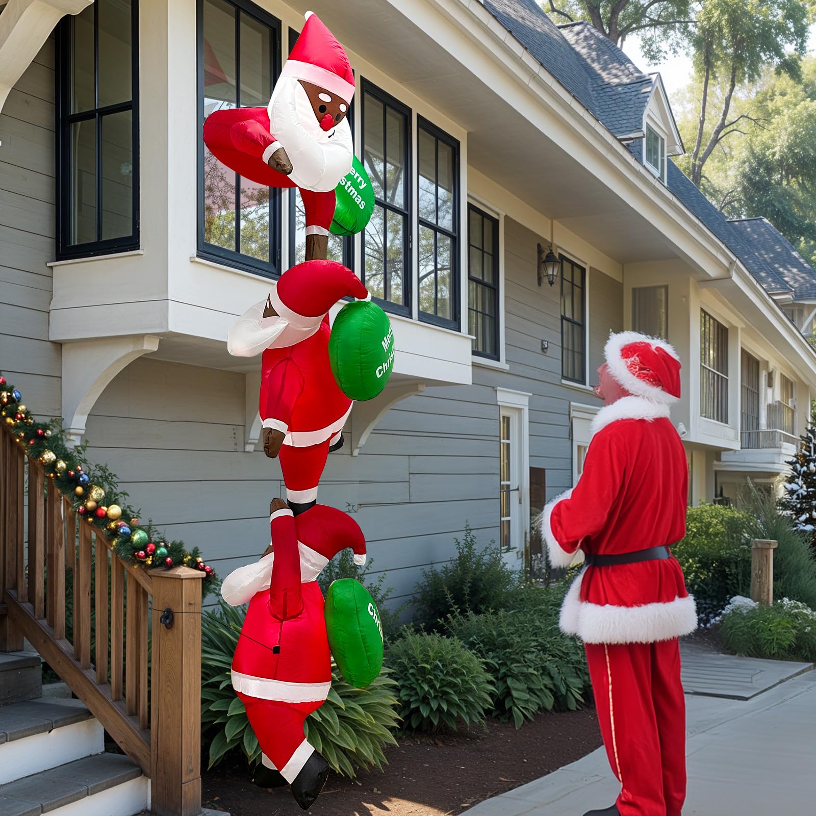 GUDELAK Santa beside a person for height scale and dramatic eight-foot presence