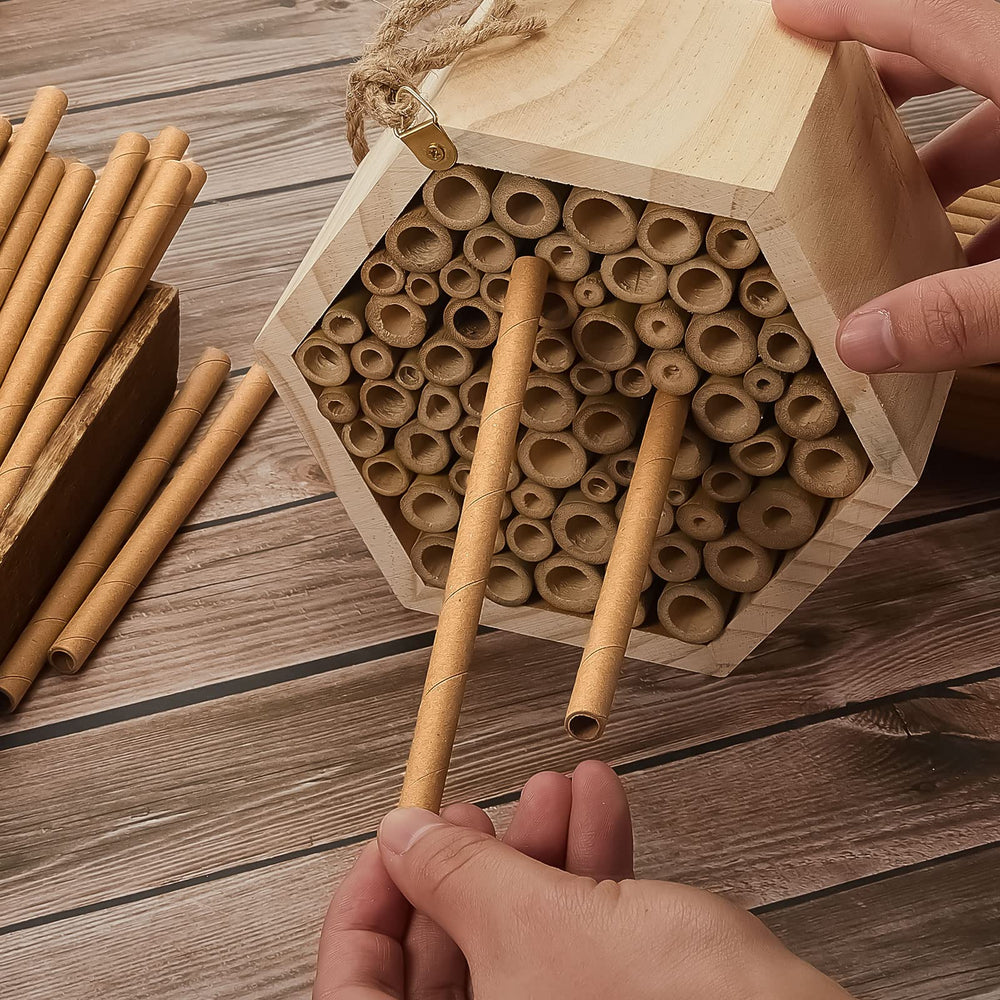 Gueevin tubes installed in a wooden bee house attracting nesting bees benefit