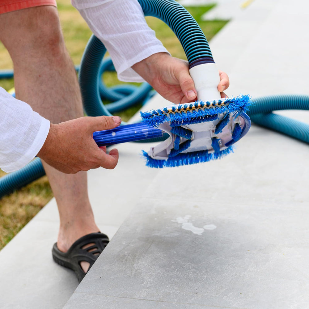 GUEQUITLEX hose laid out with measuring tape showing the full 18 foot length