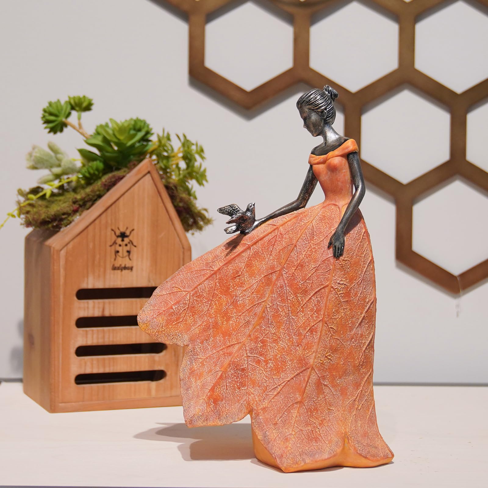 Guichifun detailed view of lily-held hand showing delicate sculptural work