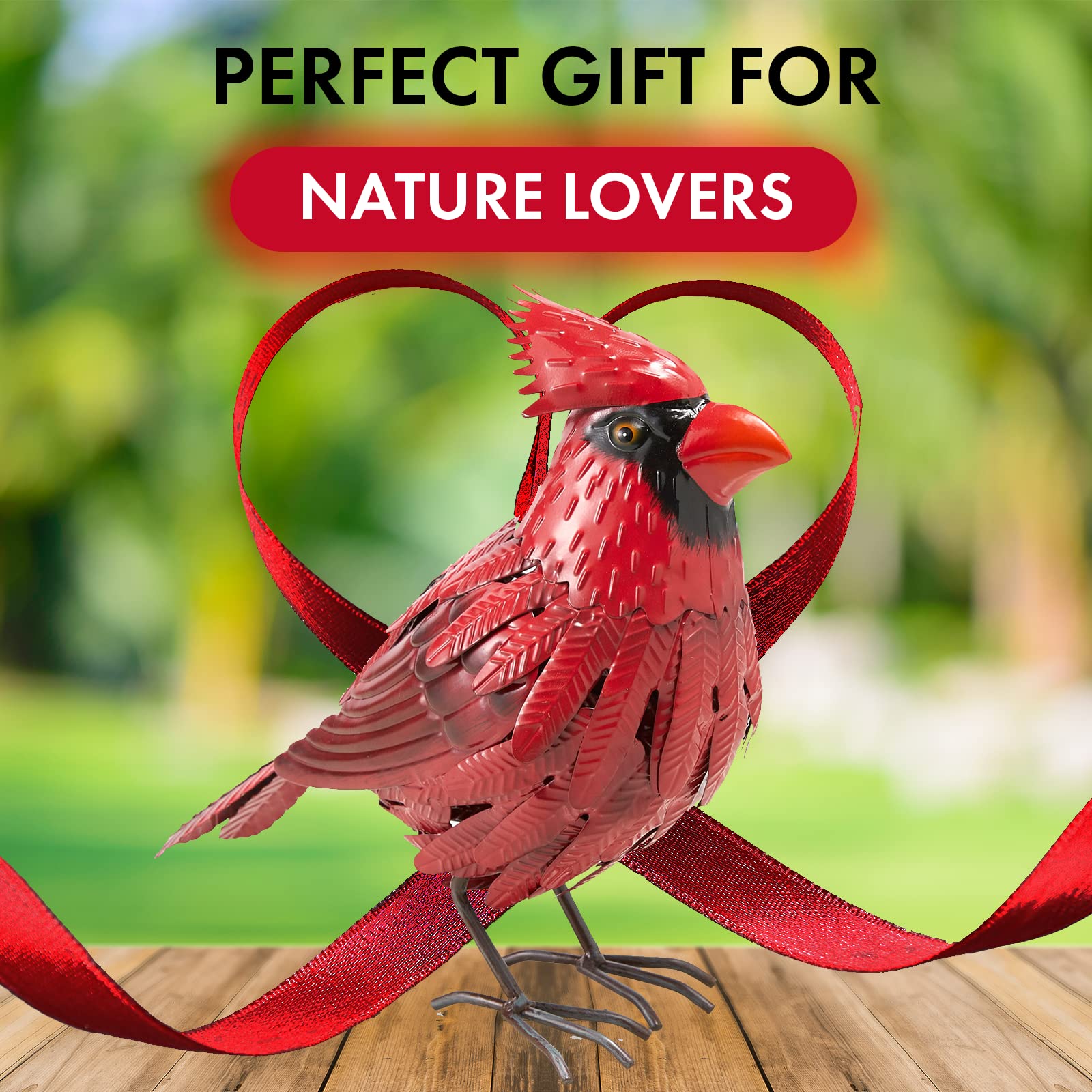 GUTE cardinal placed in flowerbed adding color and focal interest