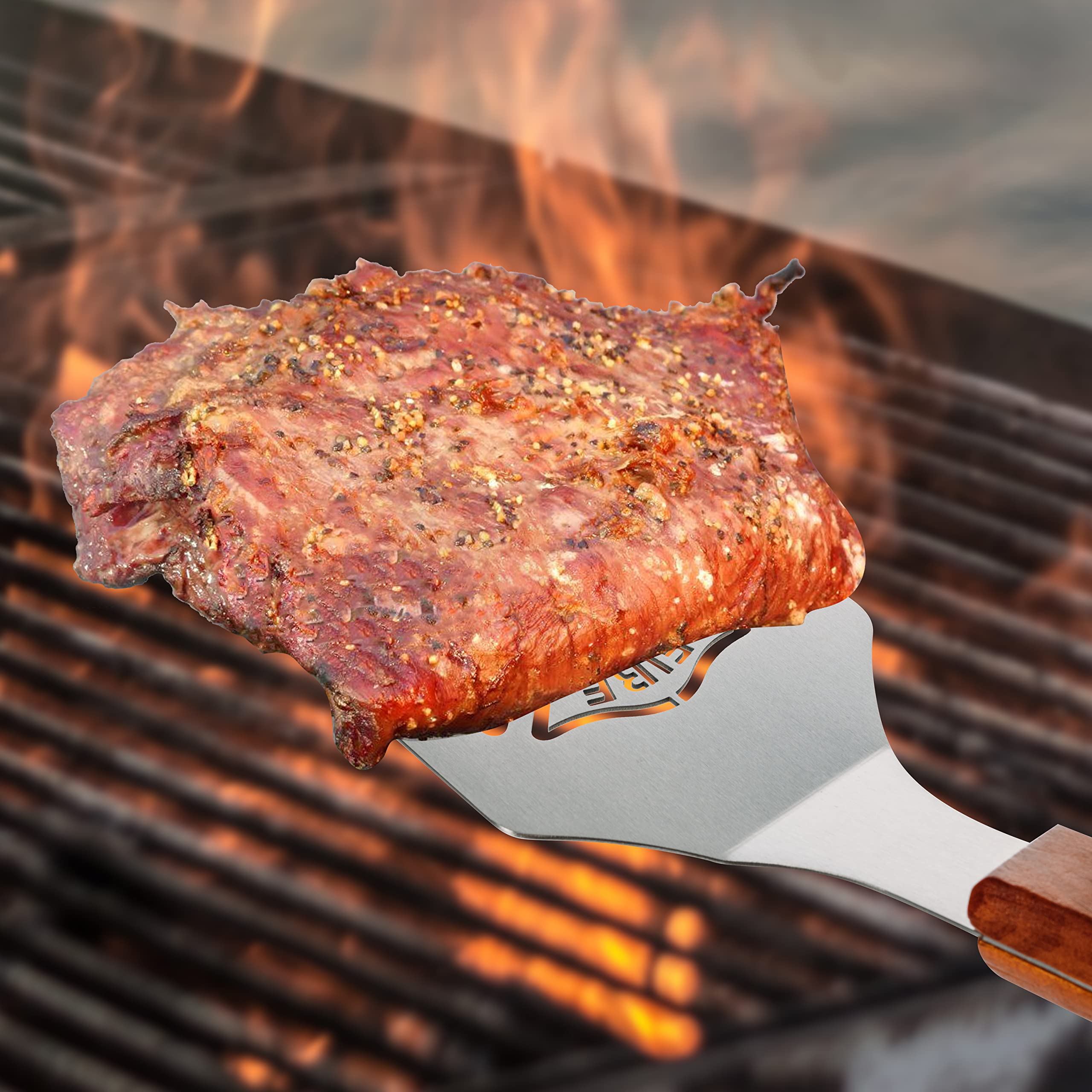 GUTE grilling scene with tools flipping steak conveying high-heat performance