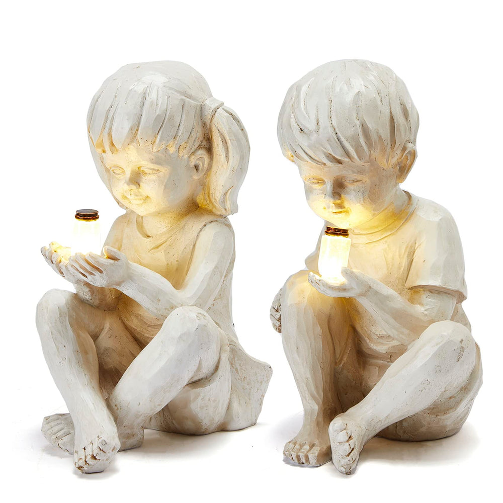 GUTE front view of boy and girl statues showing charming garden focal point