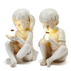 GUTE front view of boy and girl statues showing charming garden focal point
