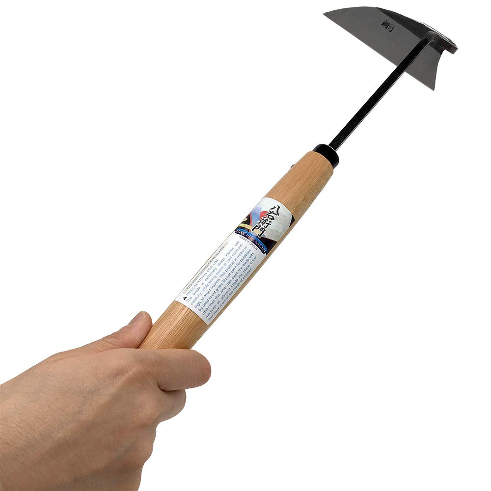 HACHIEMON tool in garden slicing weeds quickly for efficient weeding
