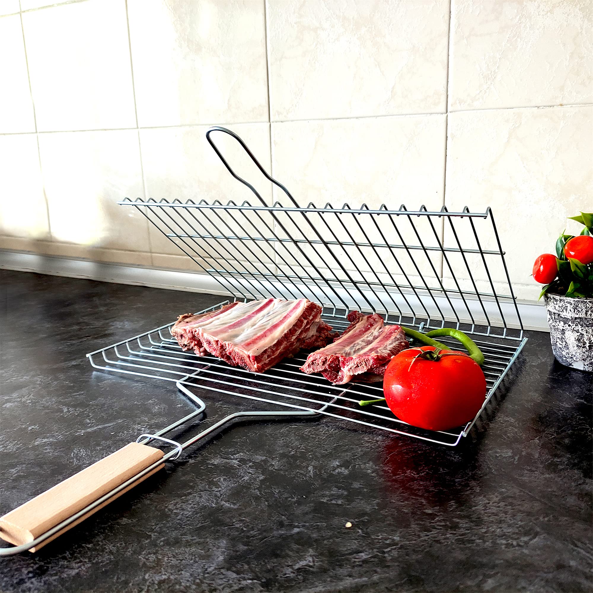 Hakan basket folded open flat to show cooking area and portability benefit
