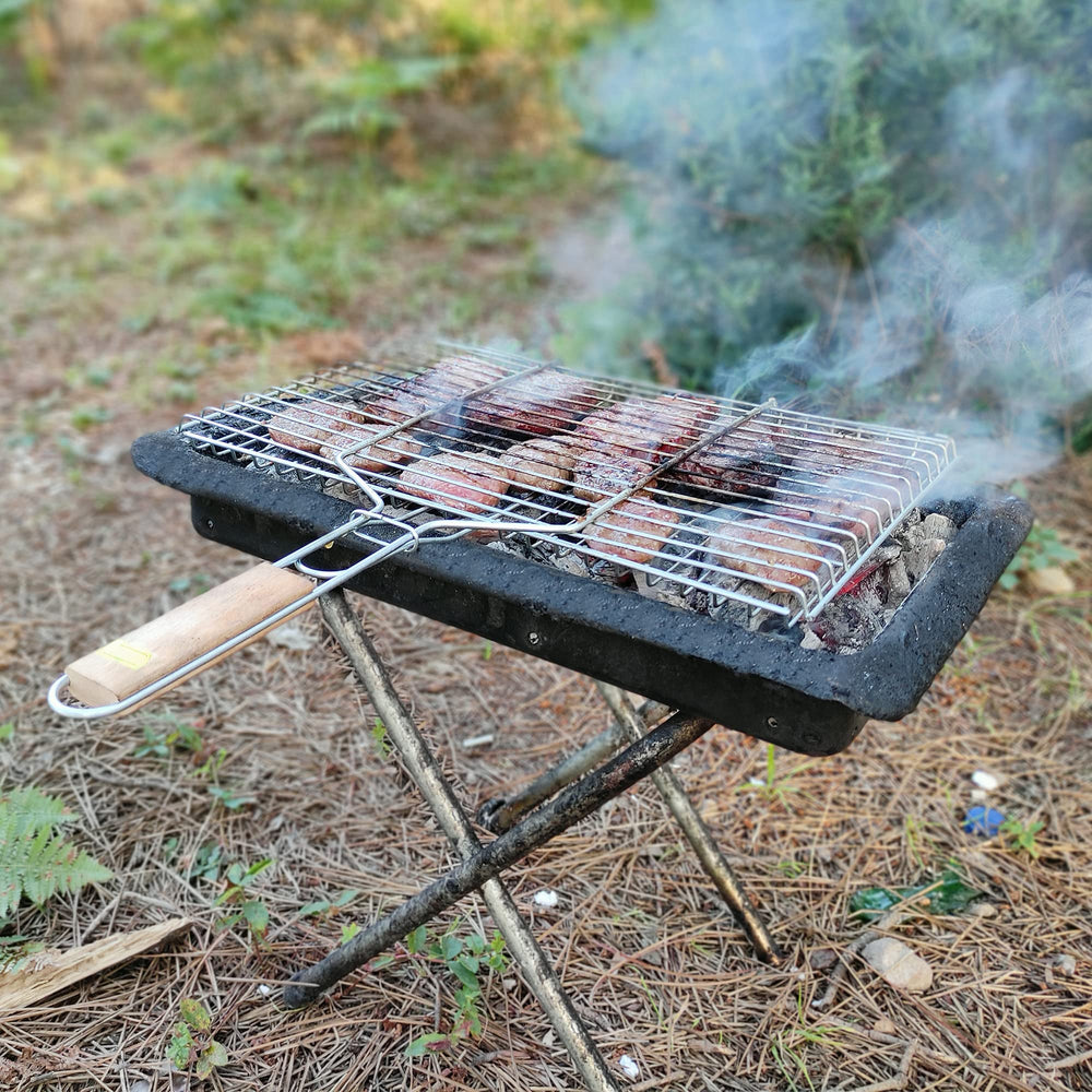 Hakan basket grilling mixed vegetables and shrimp for even cooking benefit