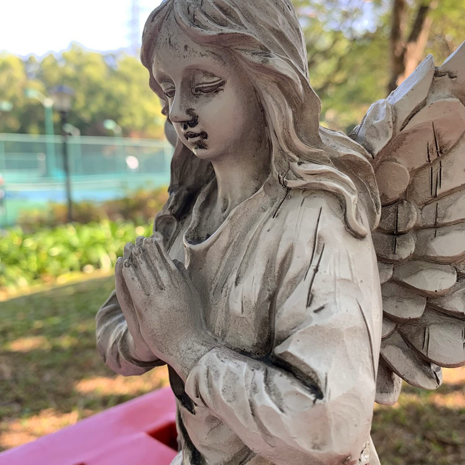 Handsider gift-wrapped statue presented as thoughtful housewarming or special gift