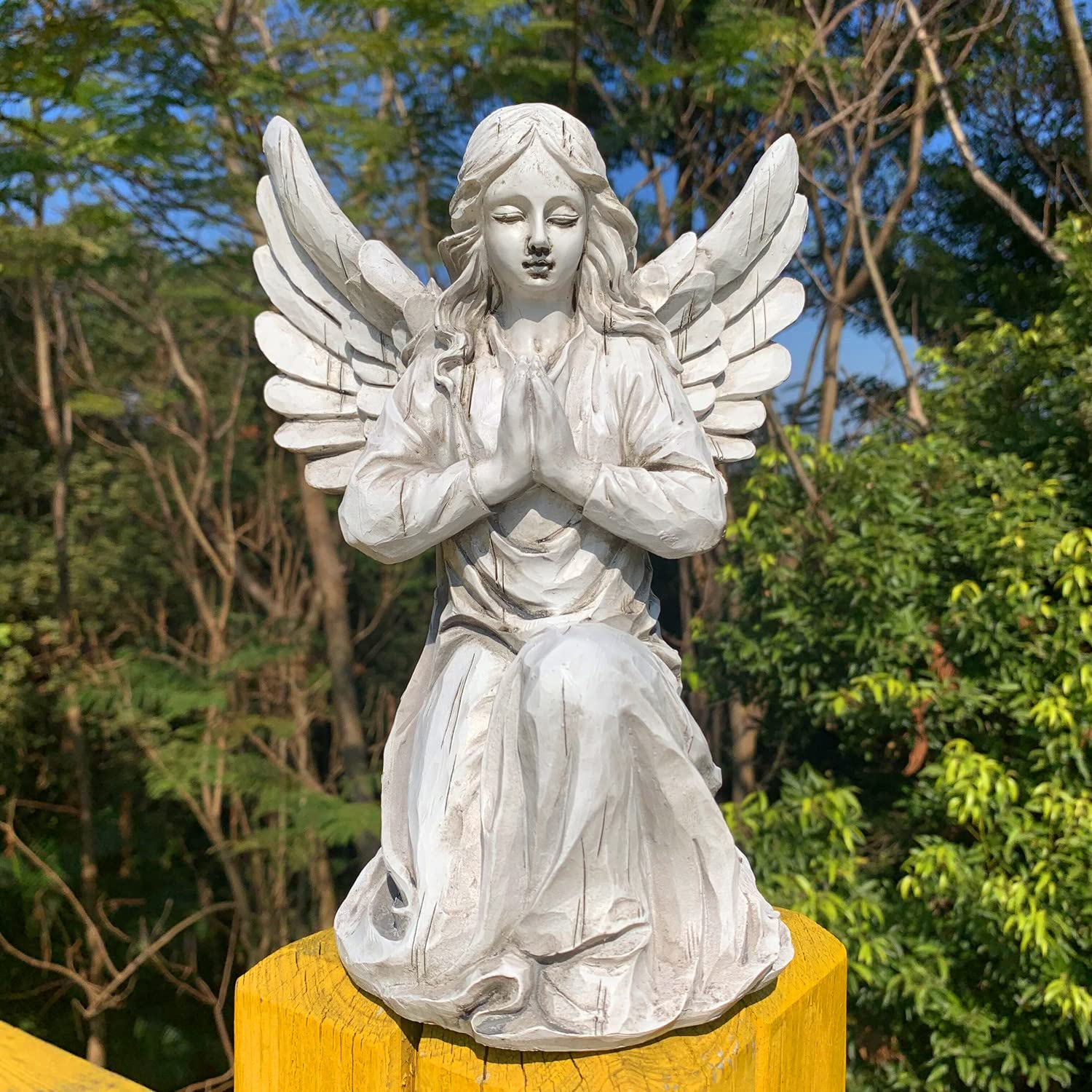 Handsider statue next to ruler showing compact size and easy placement benefit
