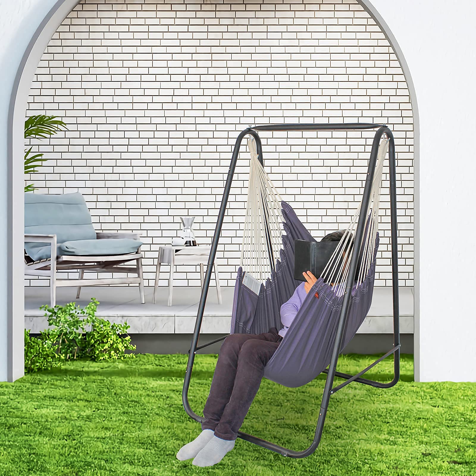 HANLU YUCAN hanging chair in patio setting showing outdoor durability and relaxation benefit