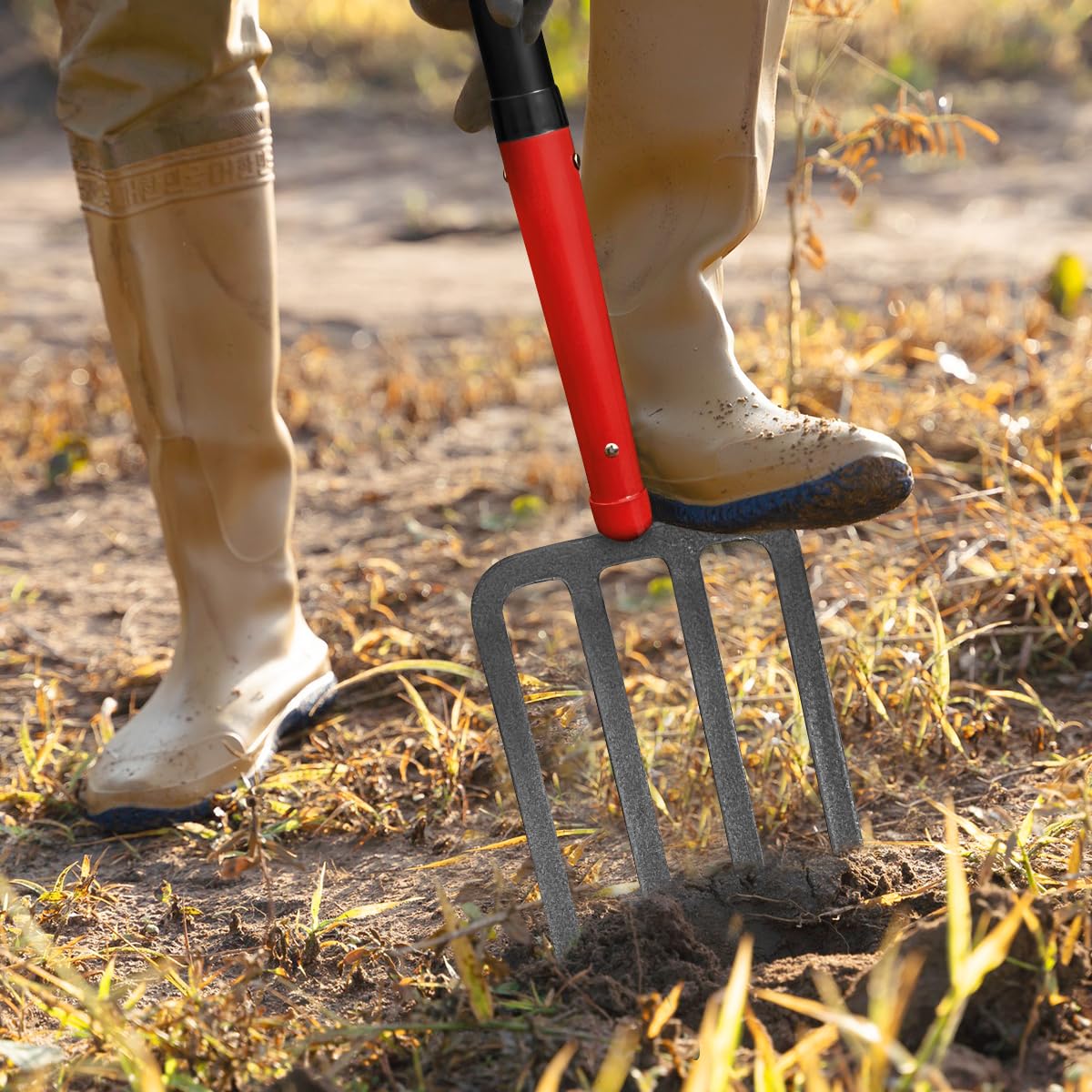 HANTOP pitch fork being used in a garden for turning soil and lifting roots efficiently