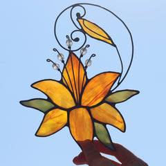 HAOSUM suncatcher in window casting colorful light and warming a sunlit sill