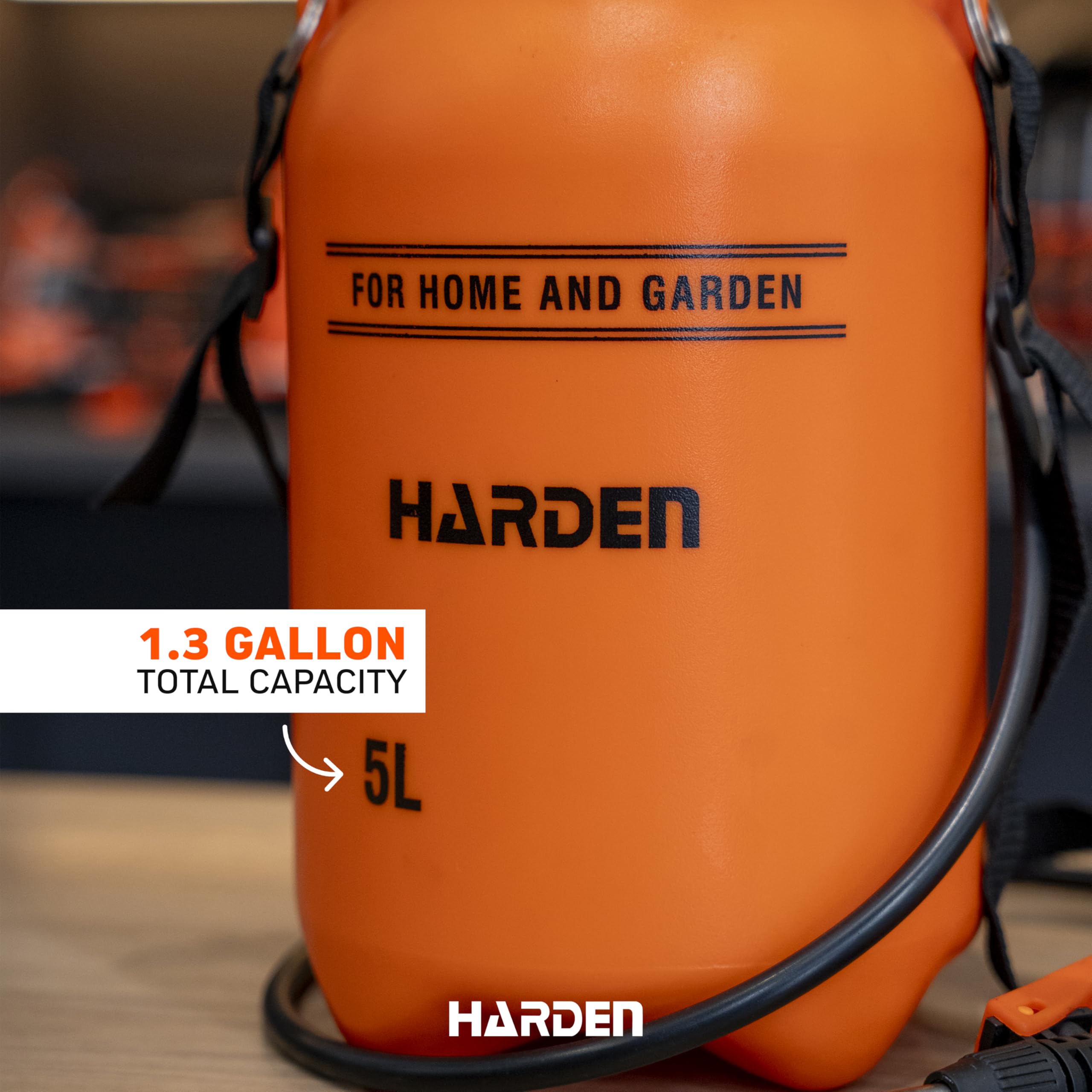 Harden sprayer in use on lawn applying fertilizer with even coverage and reduced refills