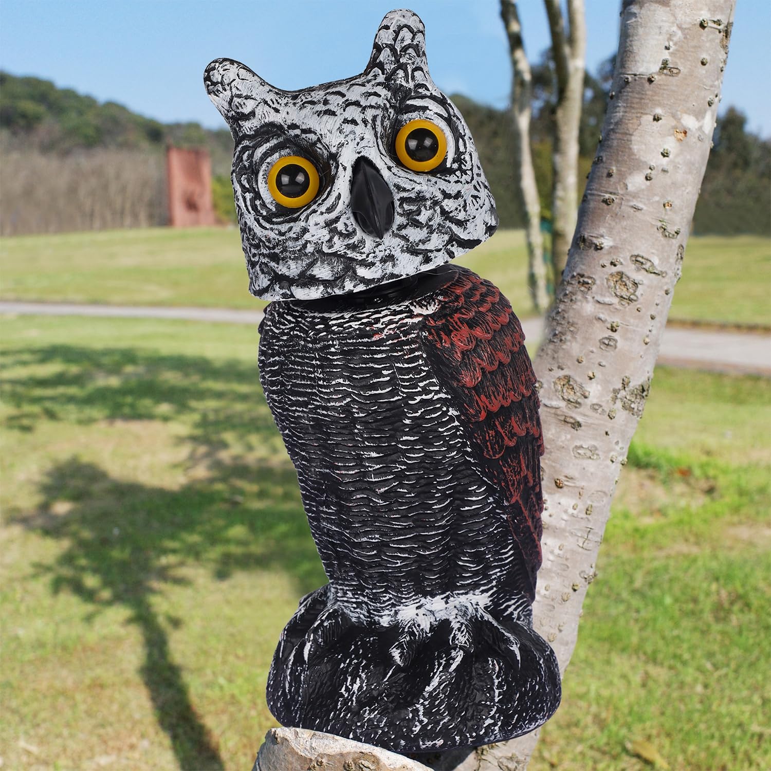 Hausse owl next to hand showing scale and portable, easy placement benefit