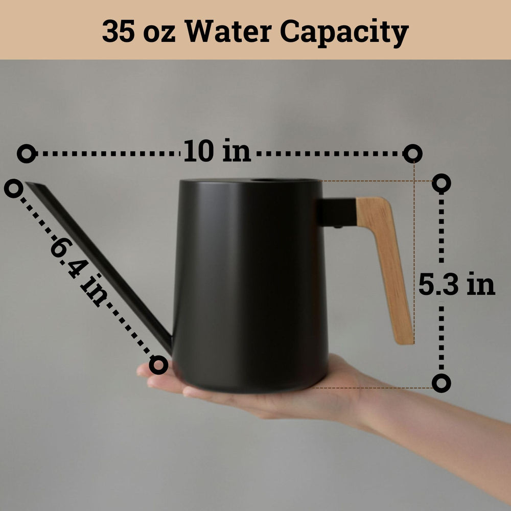 HB Design Co. watering can in use pouring at soil level for accuracy