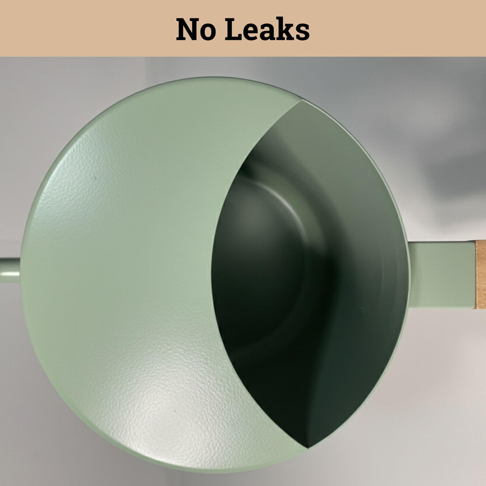 HB Design Co. pouring water into a hanging pot demonstrating controlled accuracy