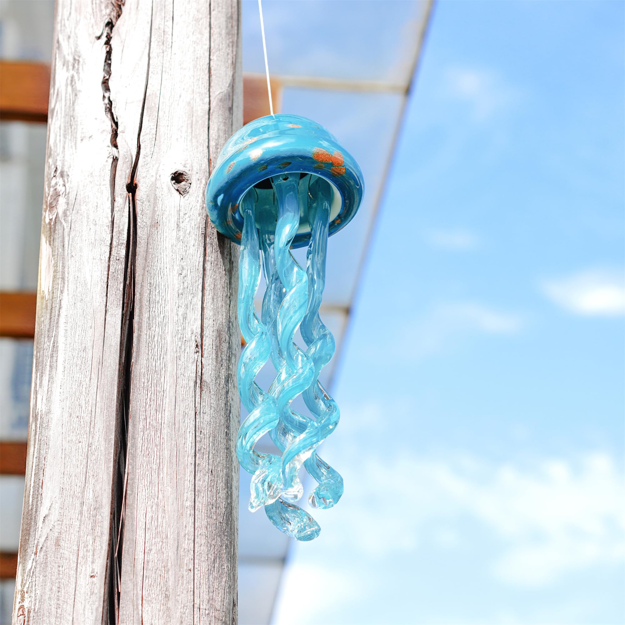 H&D HYALINE & DORA jellyfish chime glowing under lantern for evening ambiance benefit