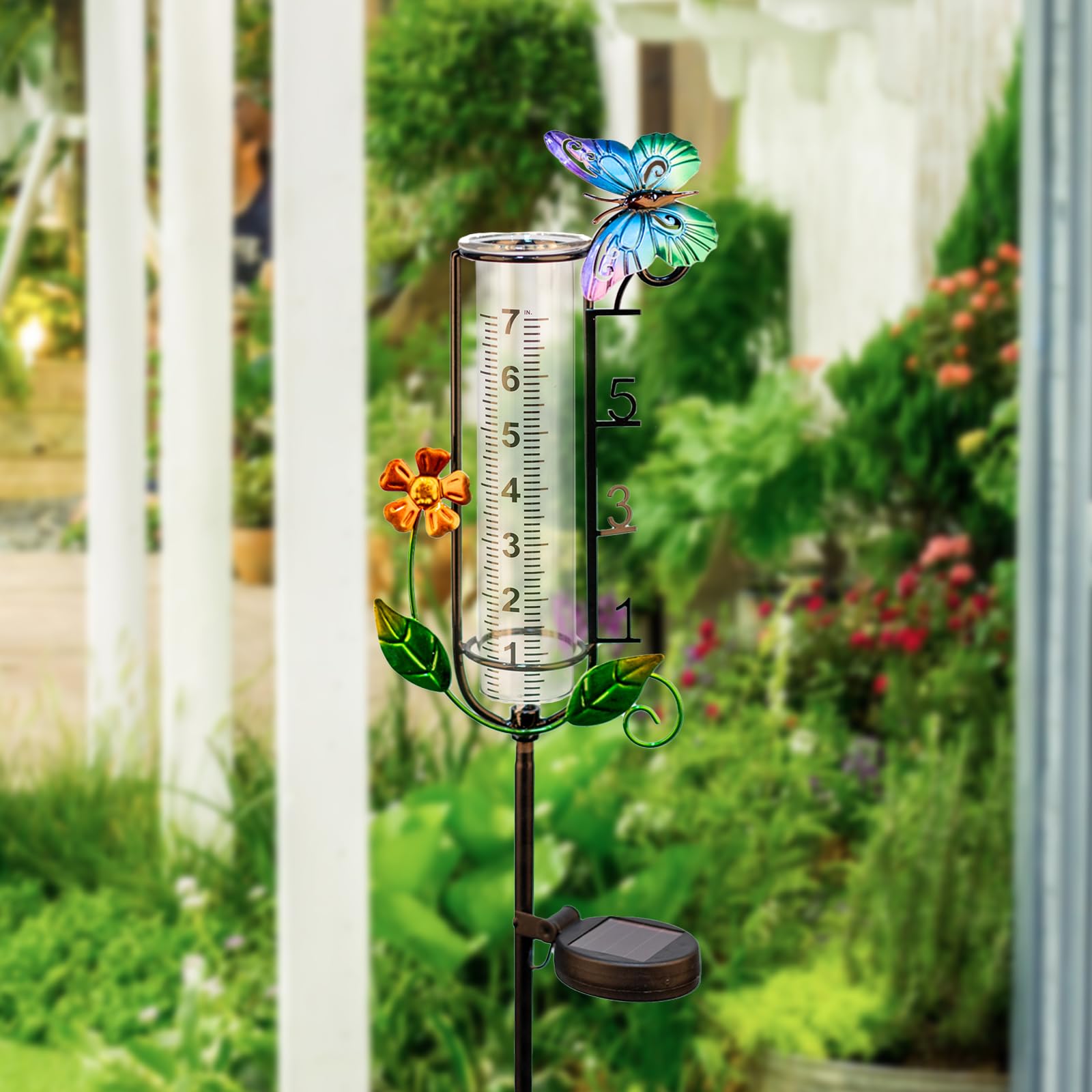 HDUAN IDT rain gauge next to garden rake for scale, shows full 45-inch height