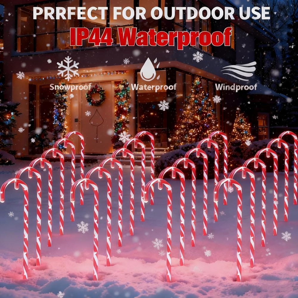 HelixBeam candy cane lights installed in yard at night improving walkway visibility and curb appeal