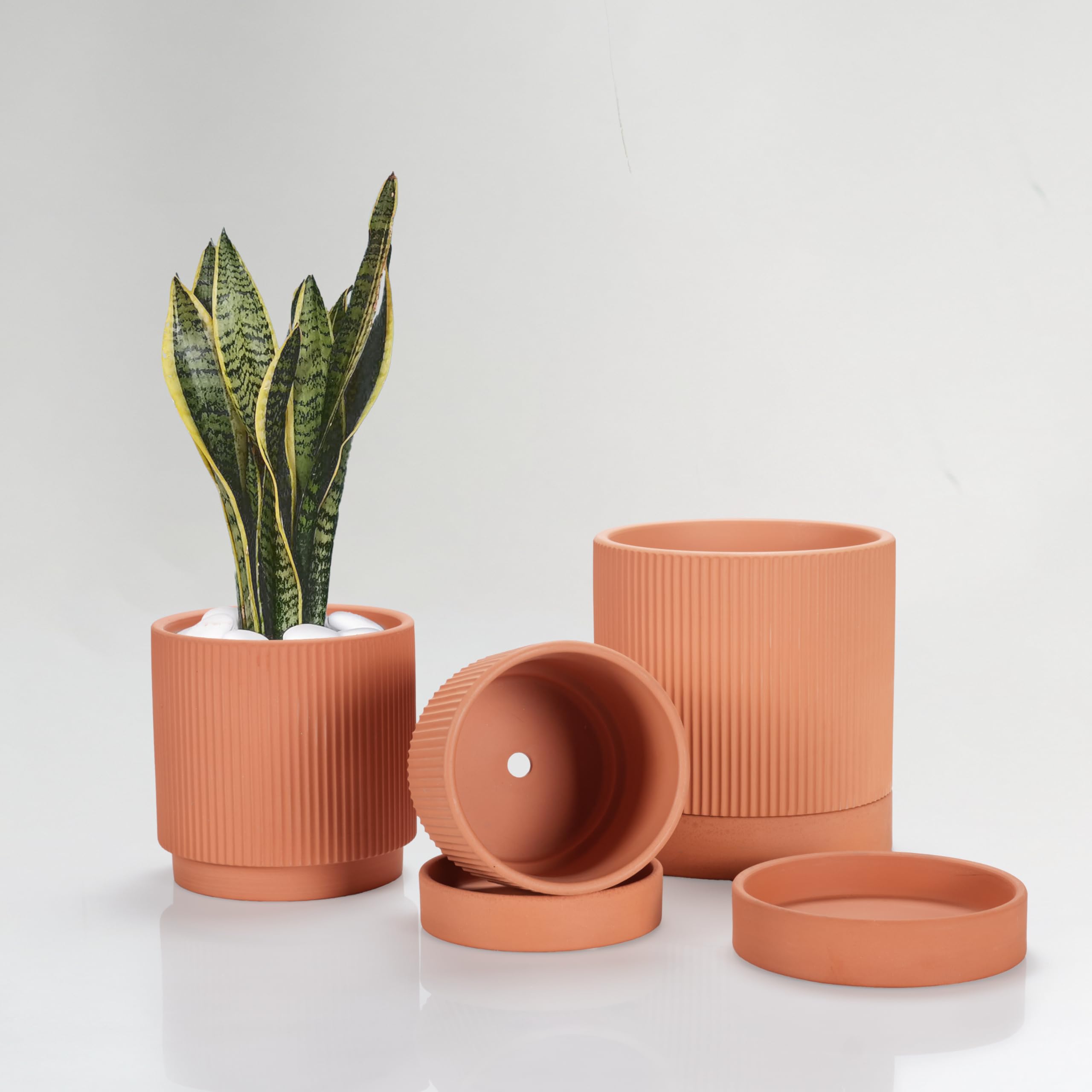 HERDUK front view of three ribbed terracotta pots showing sizes and aesthetic benefit