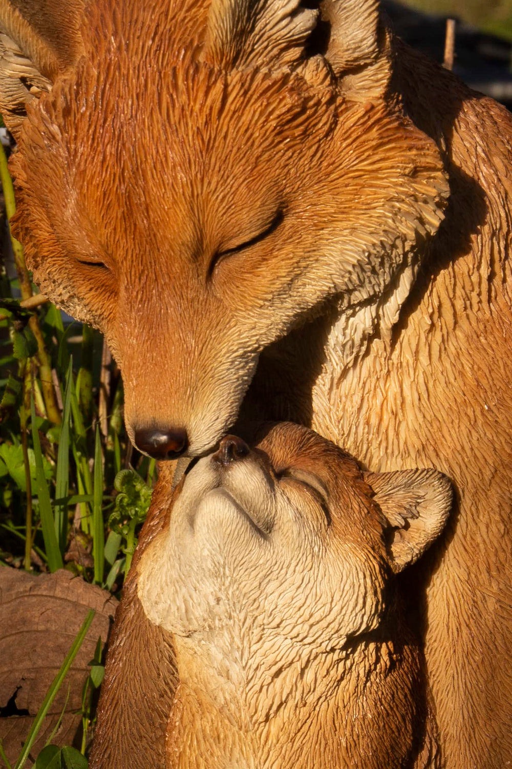 HI-LINE side profile of cuddling fox statue highlighting lifelike silhouette benefit