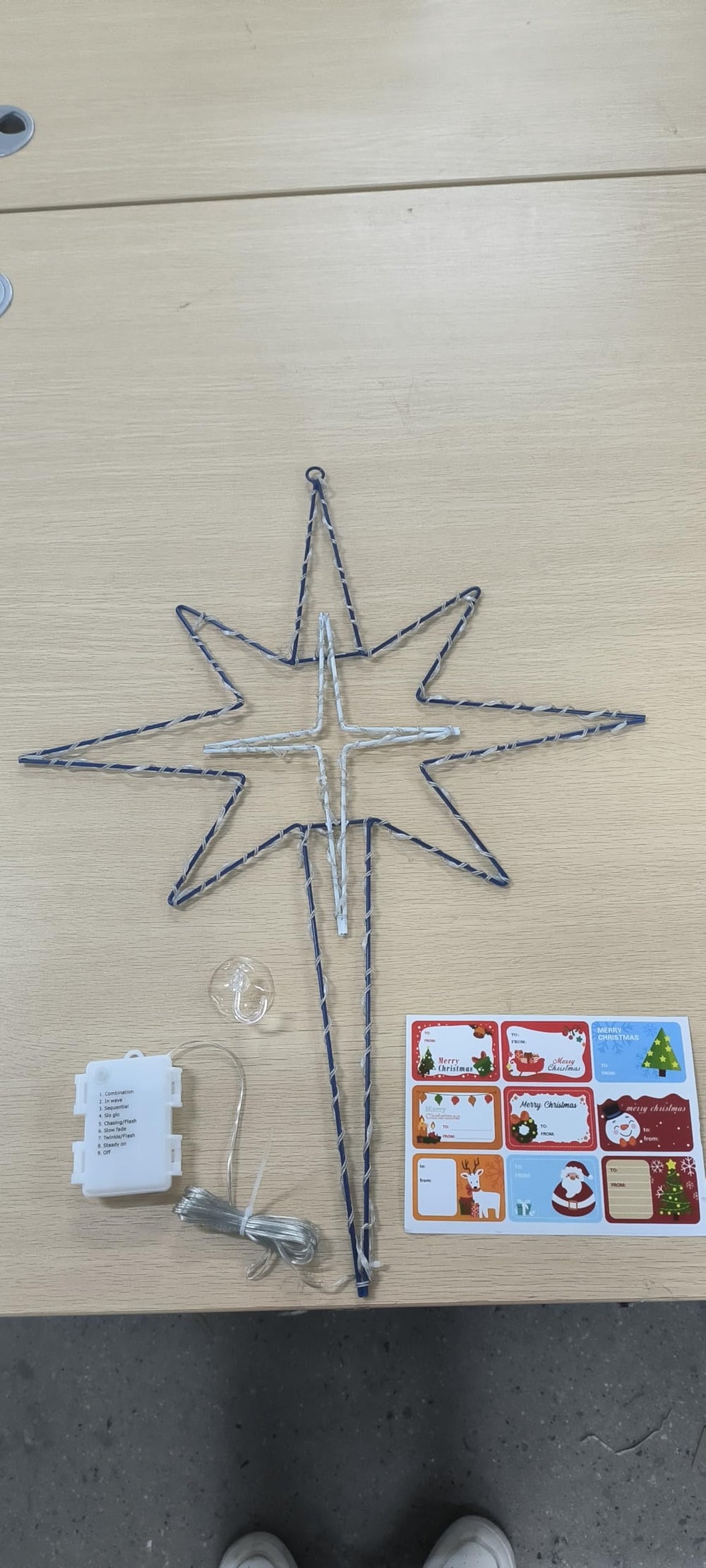Hiboom packaging layout displaying included hook and stickers for straightforward setup