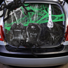 Hiboom spiders arranged on a car trunk creating spooky trunk-or-treat ambiance