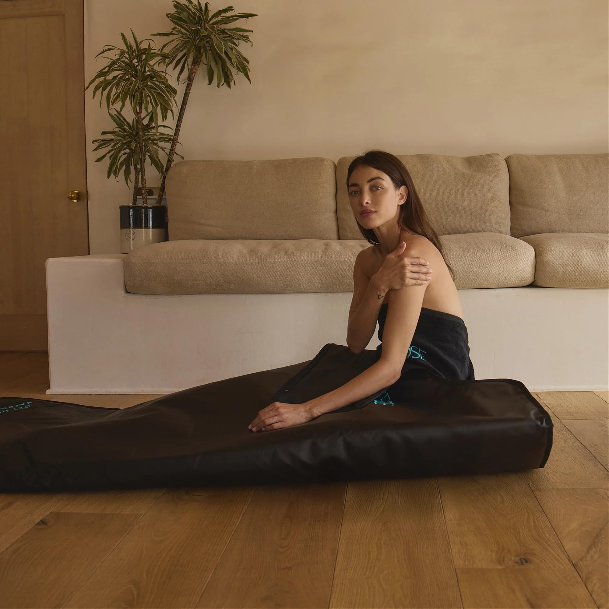 HigherDOSE blanket on bed for scale comparison showing full-body coverage