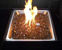 Hiland copper fire glass installed in a gas fire pit demonstrating clean modern look