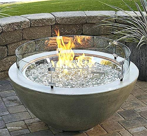Hiland wind screen in outdoor evening setting preserving flame ambiance
